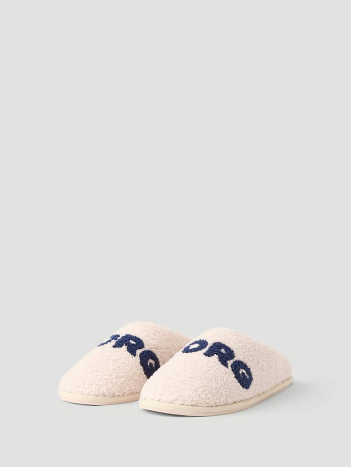 Haven Slipper in white with navy Borg branding on the vamp.