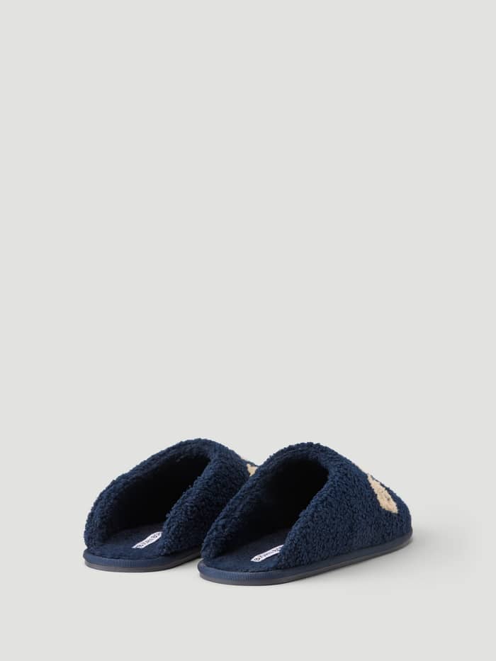 Side view of the Haven Slipper in Peacoat / Tofu showcasing the warm pile finish and slip-on design.