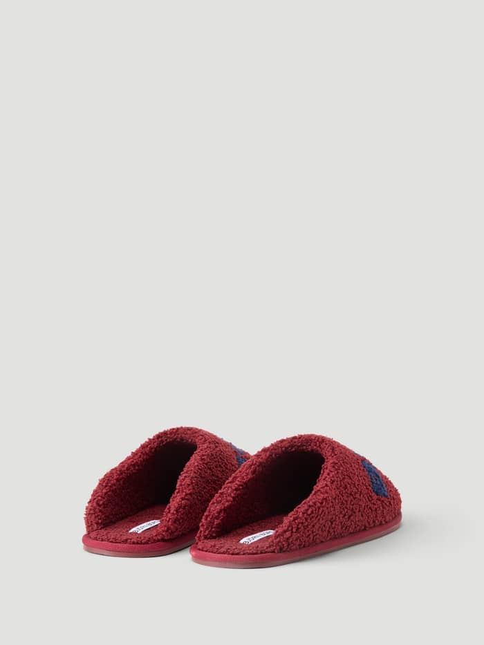 Back view of the Haven Slipper in Cabernet and Peacoat featuring soft pile and branded details.
