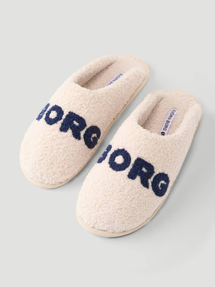 Haven Slipper in white and navy with a warm pile texture and navy Borg branding on the vamp.