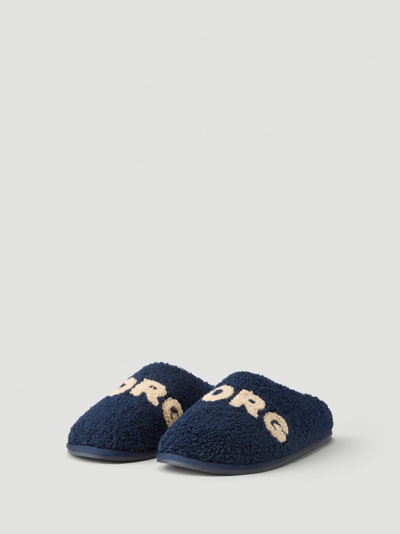 Front view of the Haven Slipper in Peacoat / Tofu, showing the warm plush pile and Borg branding on the vamp. - Image 1