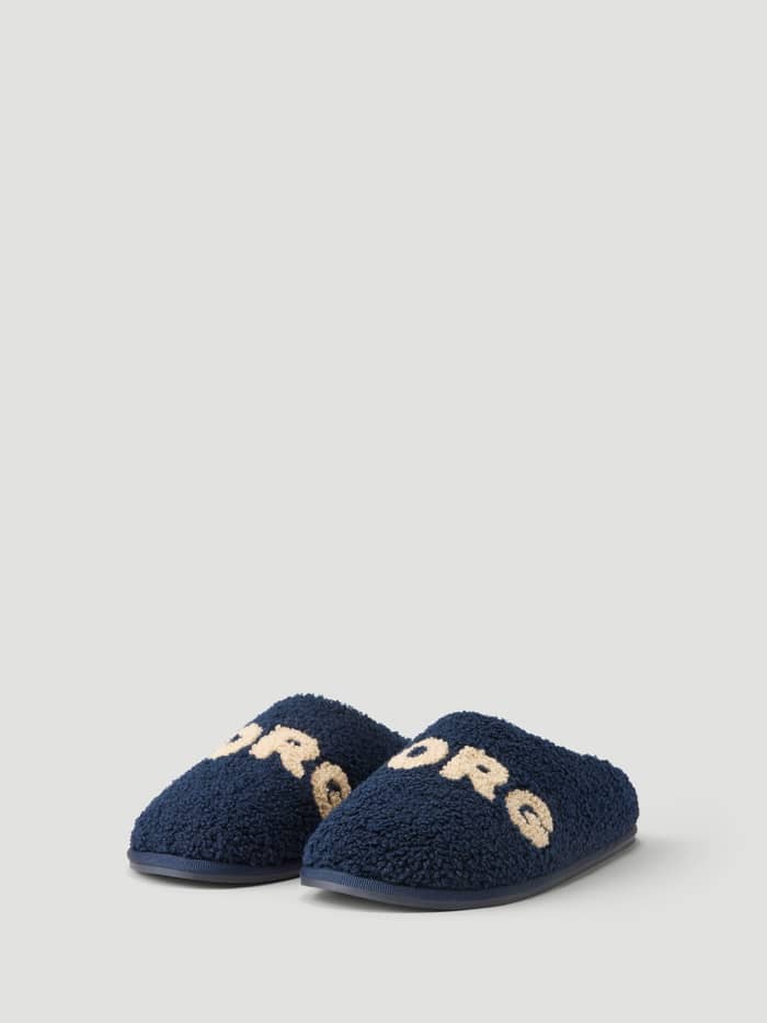 Front view of the Haven Slipper in Peacoat / Tofu, showing the warm plush pile and Borg branding on the vamp.