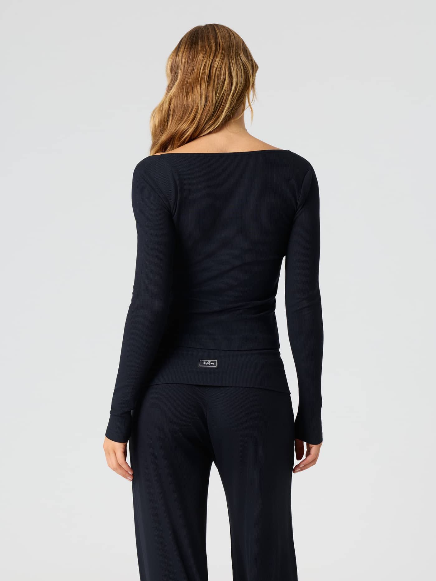Back view of the Studio Rib Long Sleeve in Black Beauty (Black) featuring a ribbed texture and long sleeves. - Image 2