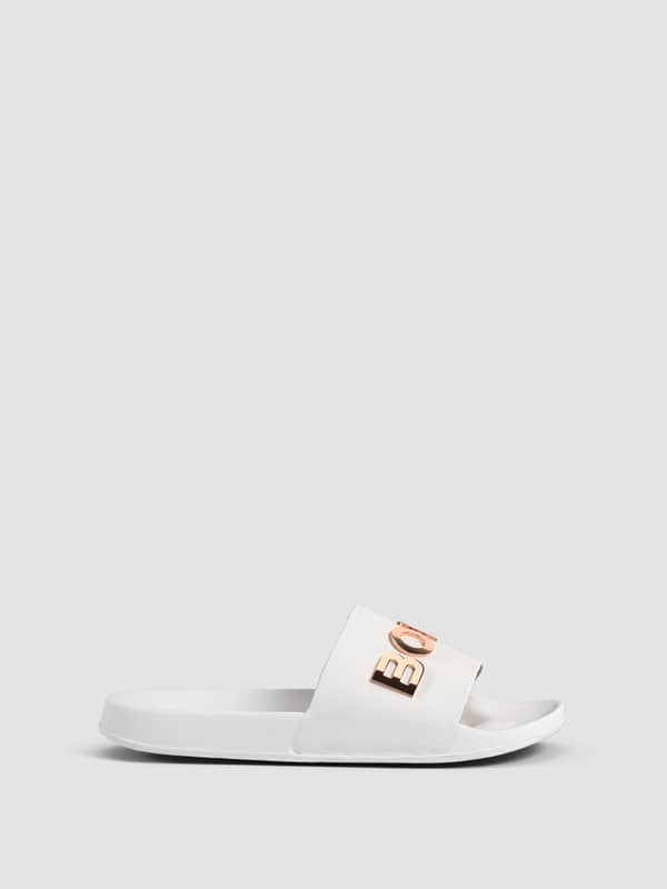 Side view of the white Women's Sandal Knox, a flexible TPU slip-on with a comfort fit and rose gold BORG logo.