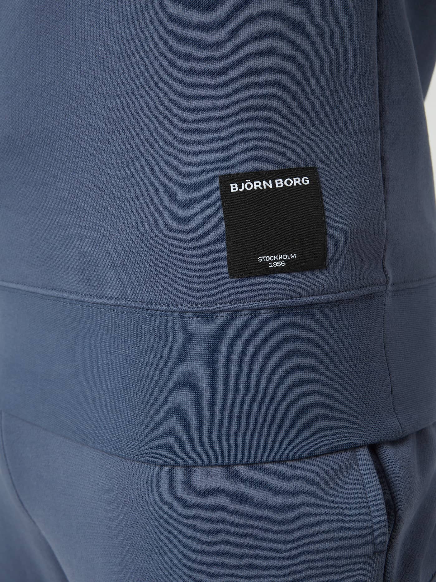 Detailed close-up of the woven logo on the Björn Borg Centre Crew in Nightshadow Blue (Blue), a soft cotton blend. - Image 5