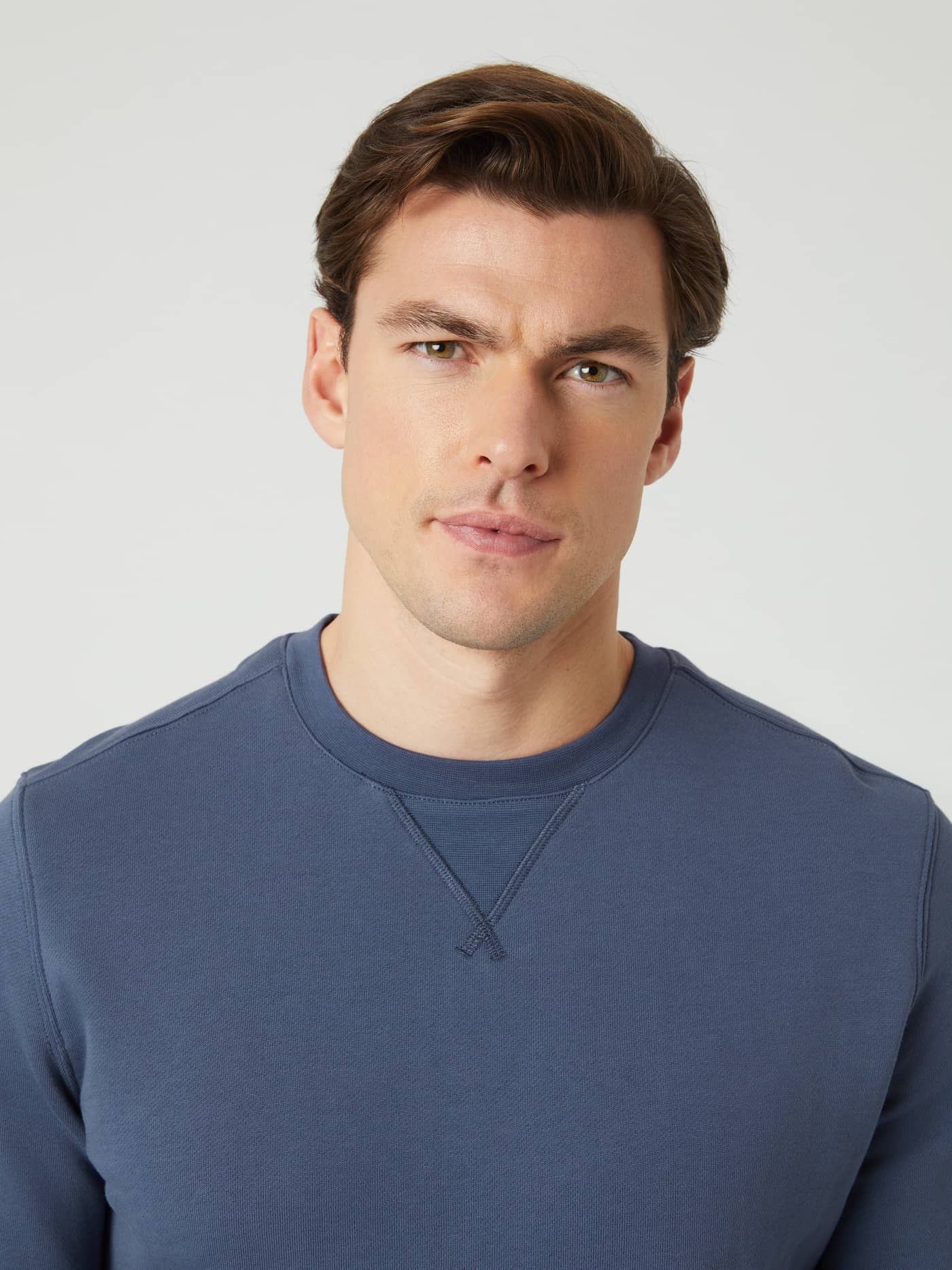 Front close-up of a man wearing the Björn Borg Centre Crew in Nightshadow Blue (Blue) with a ribbed triangle neck detail. - Image 4