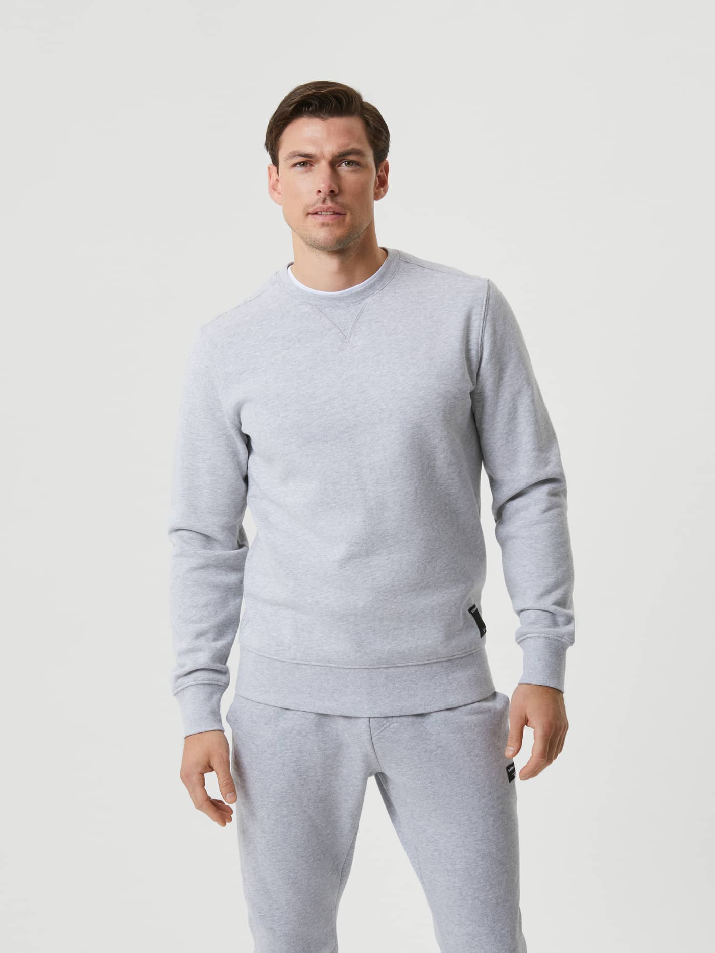 Björn Borg Centre Crew in Light Grey Melange (Grey) on a man, featuring a stylish, functional fit and a black logo. - Image 2