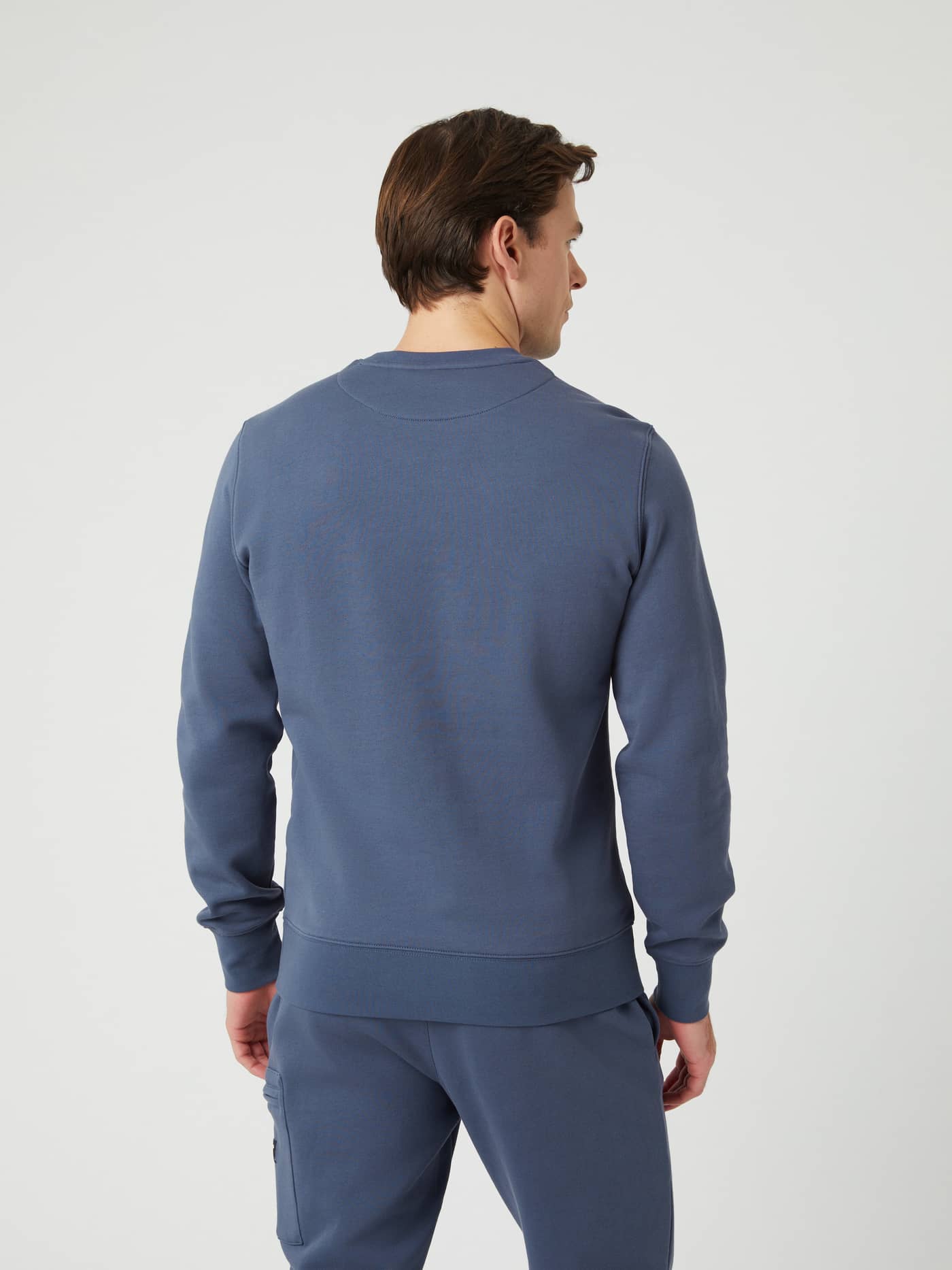 Back view of a man wearing the regular fit Björn Borg Centre Crew in Nightshadow Blue (Blue), made of a soft cotton blend. - Image 2
