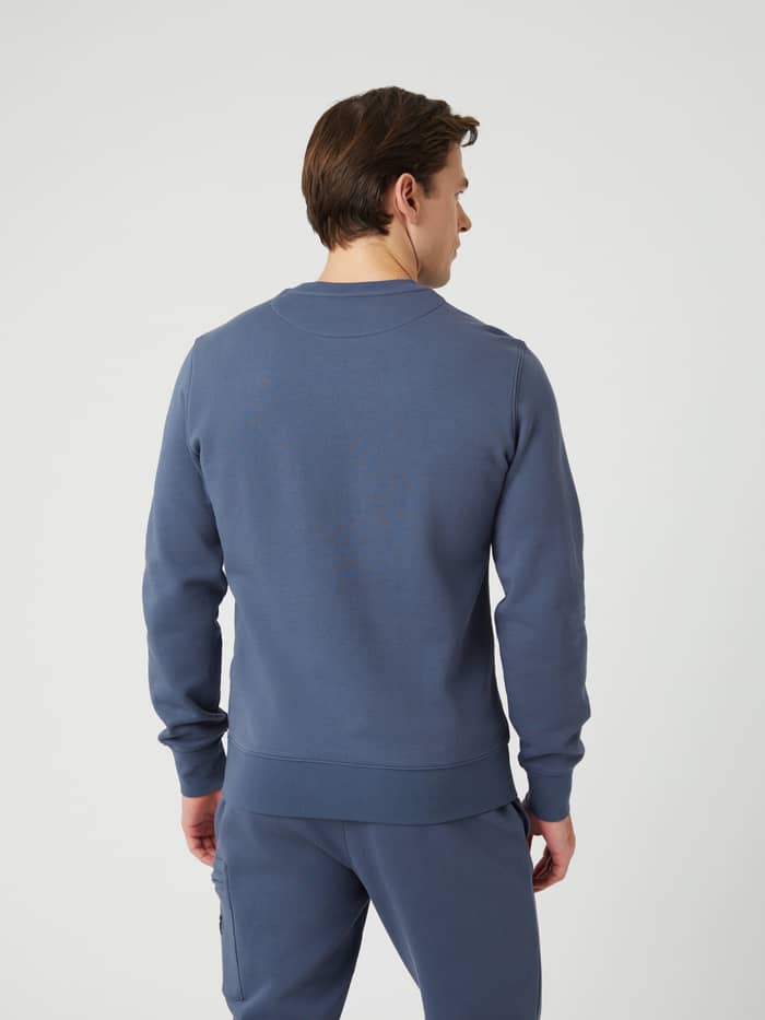 Back view of a man wearing the regular fit Björn Borg Centre Crew in Nightshadow Blue (Blue), made of a soft cotton blend. - Image 2