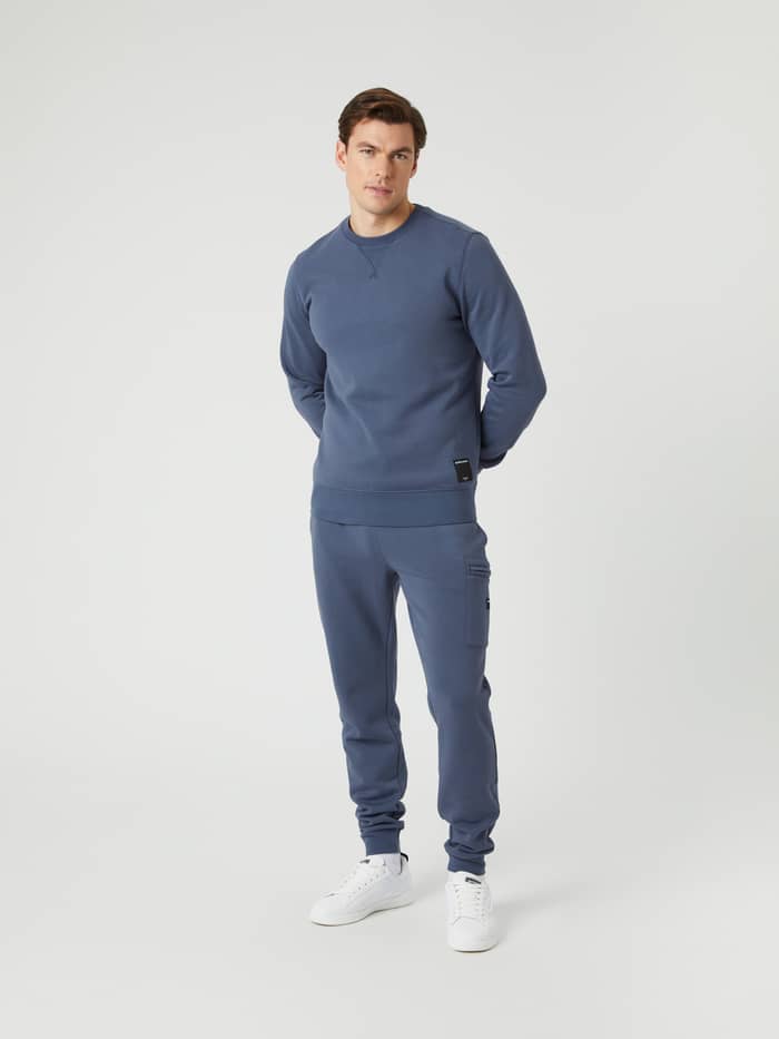 Full-body front view of a man wearing the Björn Borg Centre Crew in Nightshadow Blue (Blue) for a classic everyday look. - Image 3
