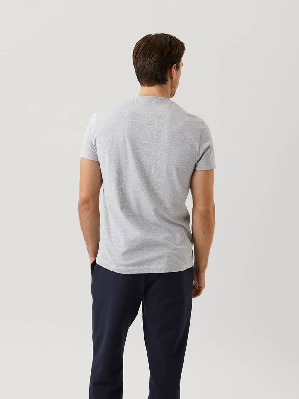 Back view of a man wearing the Björn Borg Centre Tee in light grey melange (grey), crafted from soft 100% cotton. - Image 2
