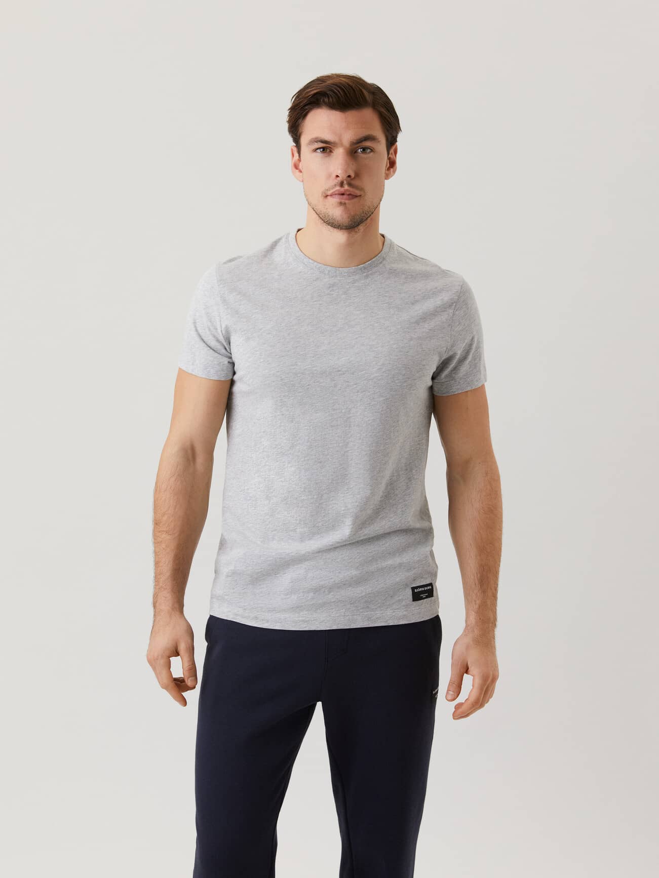 Front view of a man wearing the cotton Björn Borg Centre Tee in light grey melange (grey) with a black logo label. - Image 1