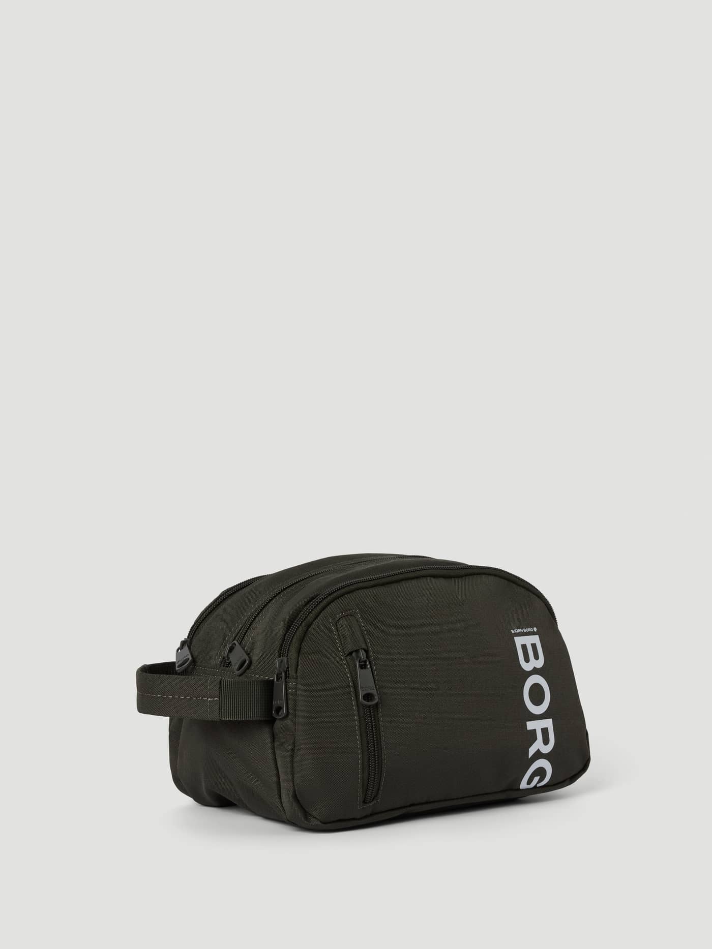 Perspective view of the stylish Forest Night (Green) Core Wash Bag Standing in recycled polyester with a white BORG logo. - Image 2