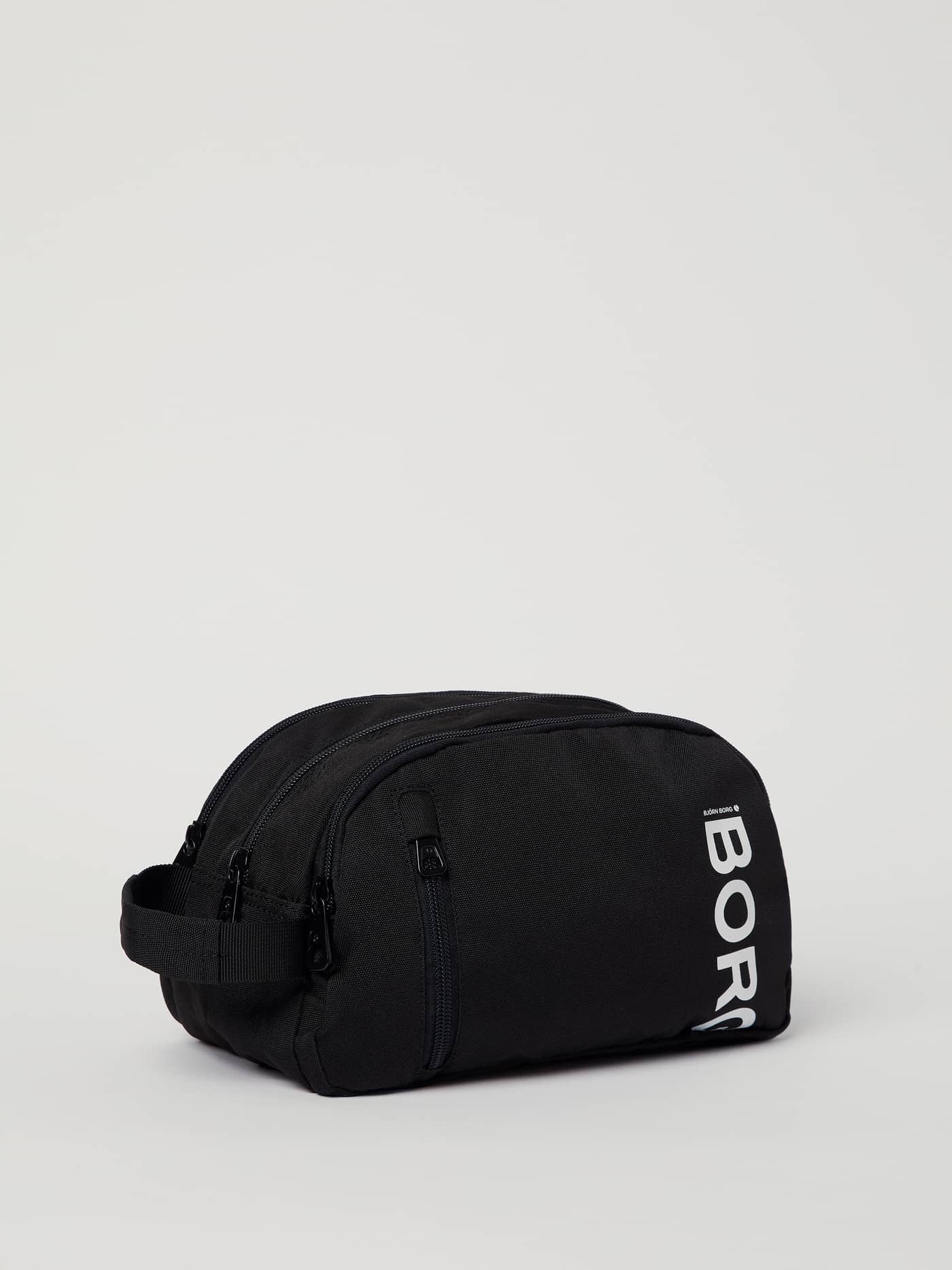 Side view of the black Core Toilet Case Standing in recycled polyester featuring a prominent white BORG logo. - Image 2