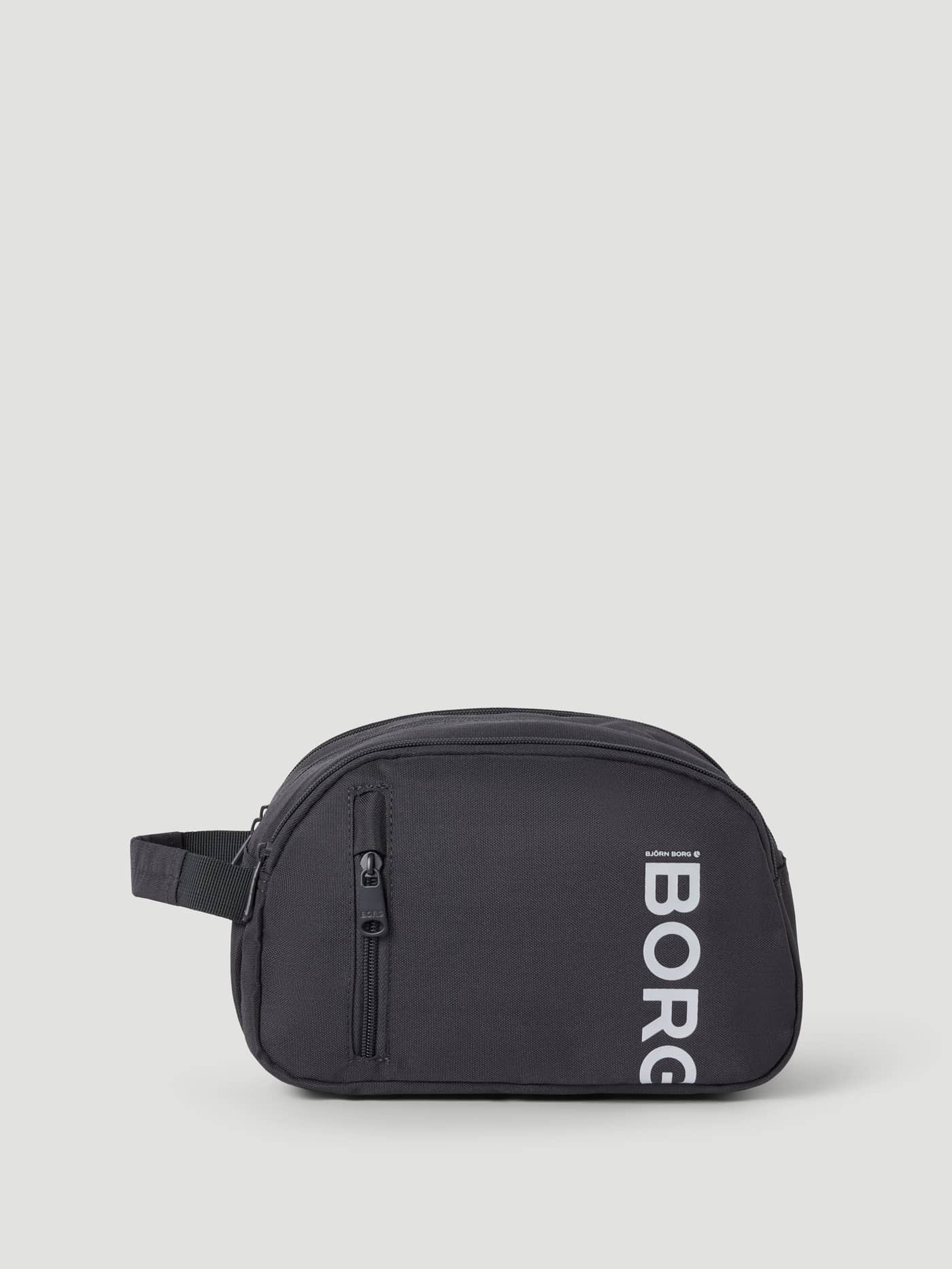 Vue de face de la trousse de toilette Core Wash Bag Standing en Asphalt (Gris) en polyester recyclé avec logo BORG blanc. - Image 1
