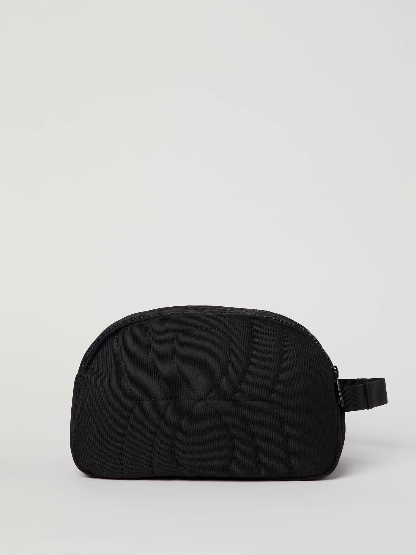 Front view of the Core Toilet Case Standing in black, a durable recycled polyester toiletry bag with a side handle. - Image 5