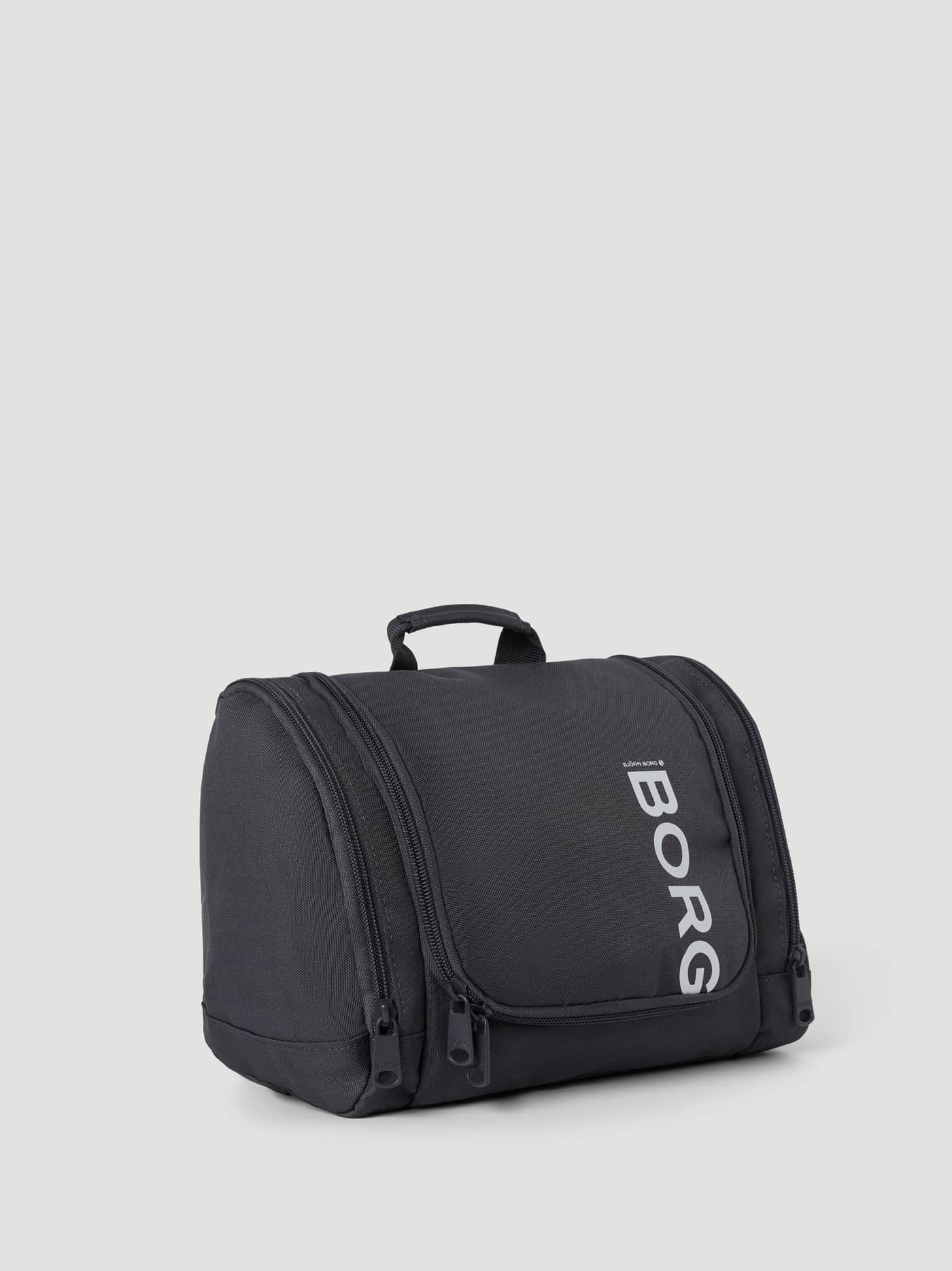 Asphalt (Grey) Core Wash Bag Hanging in recycled polyester featuring a top handle and a large white BORG logo. - Image 3